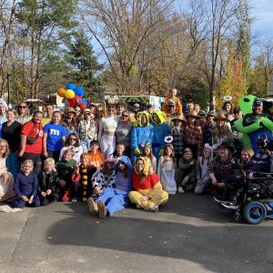 In one moment, the volunteers, families, and staff who were a part of the Trunk or Treat event this year.